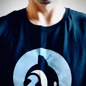 Portrait of me in my Orcfax tee, featuring our company mascot, Echo