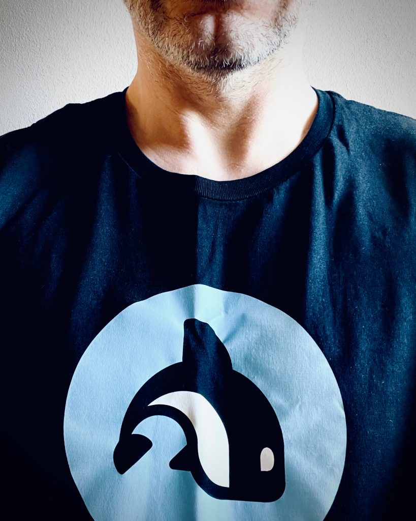 Portrait of me in my Orcfax tee, featuring our company mascot, Echo